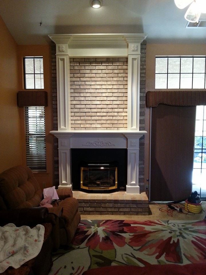 Photo of a medium sized classic enclosed games room in Other with beige walls, carpet, a standard fireplace and a wooden fireplace surround.