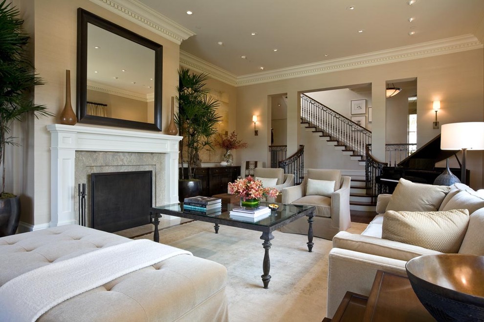 Elegant family room photo in San Francisco with beige walls and a standard fireplace