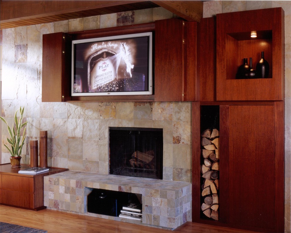 Inspiration for a modern light wood floor family room remodel in San Francisco with a stone fireplace, a media wall and a standard fireplace