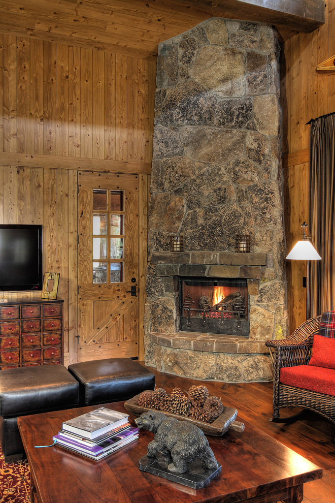 Example of a mountain style family room design in Phoenix with a corner fireplace and a stone fireplace