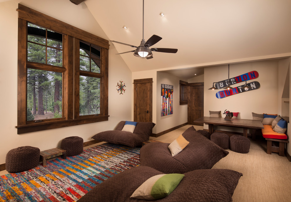 Example of a mountain style carpeted family room design in Sacramento with beige walls