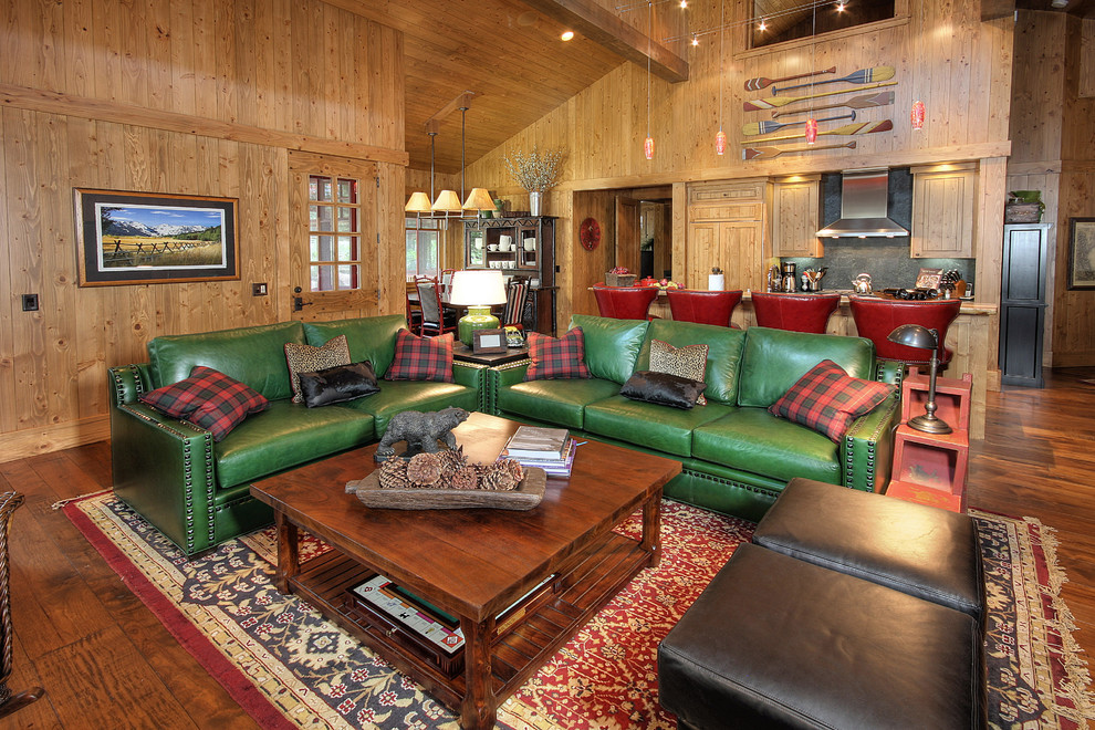 Inspiration for a rustic open concept medium tone wood floor and brown floor family room remodel in Phoenix