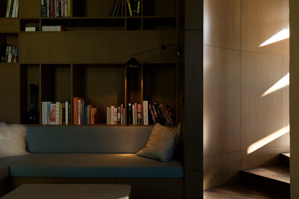 Inspiration for a small contemporary enclosed games room in Auckland with a reading nook, blue walls and carpet.