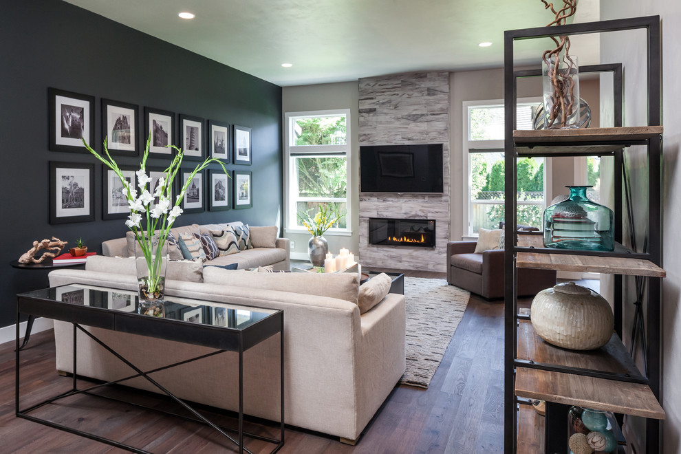 Inspiration for a large transitional open concept medium tone wood floor family room remodel in Portland with multicolored walls, a ribbon fireplace, a tile fireplace and a wall-mounted tv