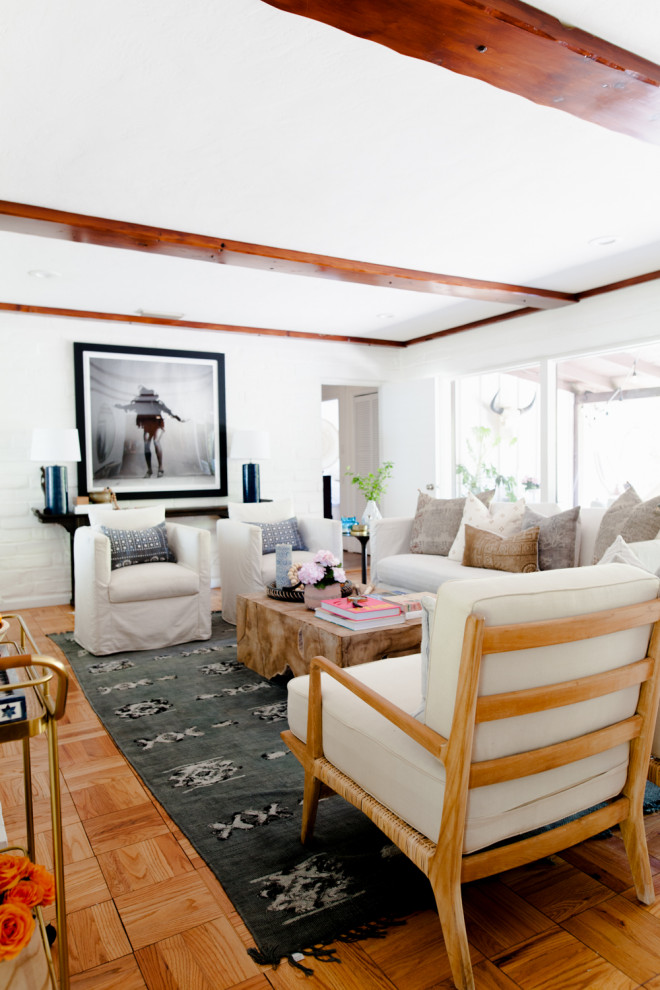 Example of a southwest family room design in Sacramento with white walls