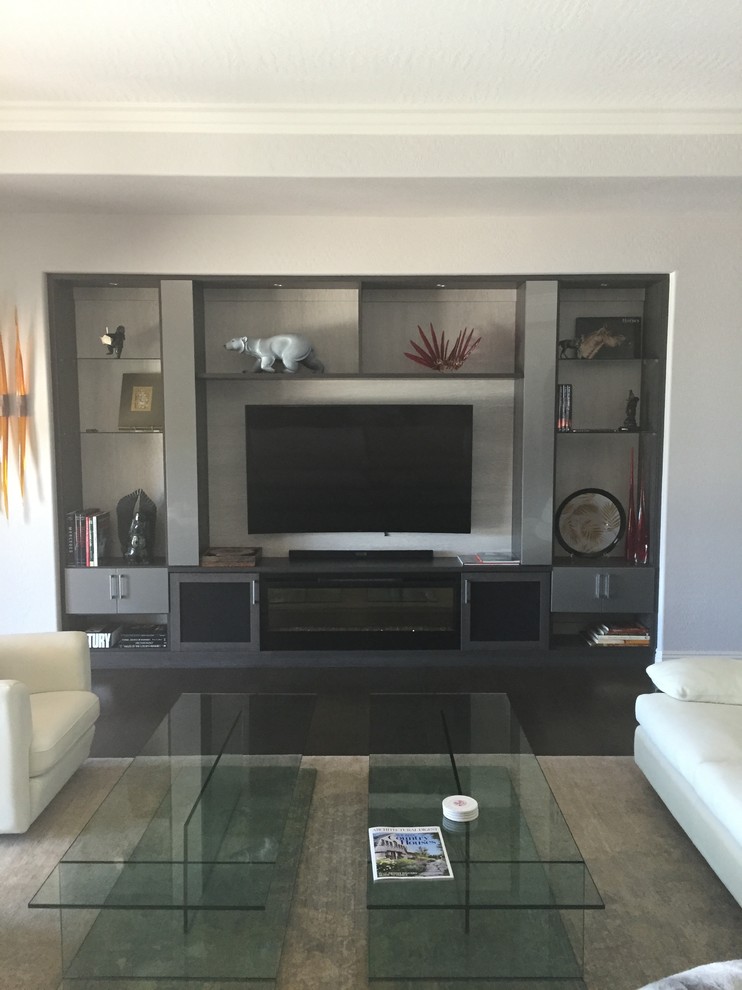 Photo of a large contemporary open plan games room in Las Vegas with grey walls, ceramic flooring, a standard fireplace and a built-in media unit.