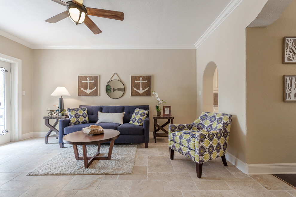 Family room - large mediterranean open concept travertine floor family room idea in Tampa with beige walls