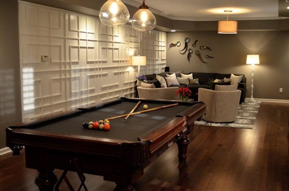 Game room - large modern enclosed laminate floor game room idea in Atlanta with gray walls and a tv stand
