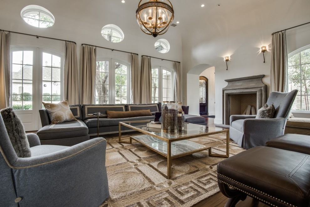 Example of a large classic enclosed dark wood floor and brown floor family room design in Dallas with white walls, no fireplace and no tv