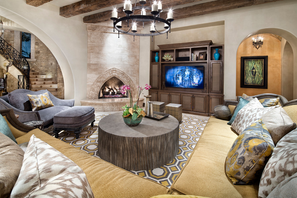 Mediterranean open plan games room in Houston with a corner fireplace, a built-in media unit and beige walls.