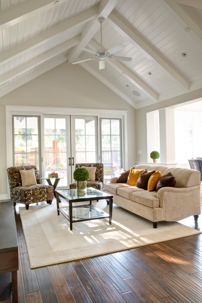 Elegant open concept dark wood floor family room photo in San Francisco with beige walls