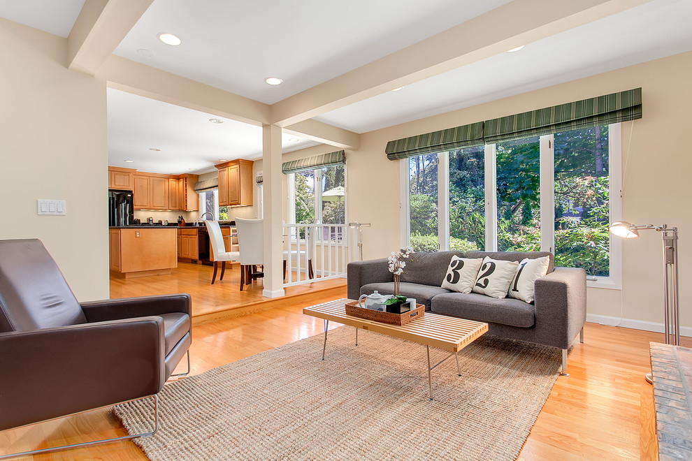 Classic living room in Seattle with beige walls and medium hardwood flooring.
