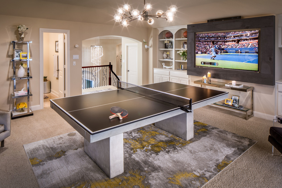 Photo of a large traditional open plan games room in Houston with a game room, beige walls, carpet, no fireplace, a wall mounted tv and beige floors.