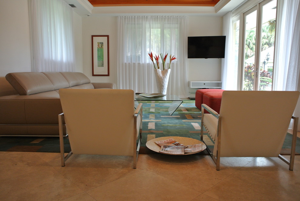 Example of a large trendy enclosed marble floor family room design in Miami with white walls and a corner tv