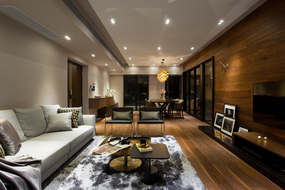 Design ideas for a contemporary games room in Hong Kong with beige walls, no fireplace and a wall mounted tv.