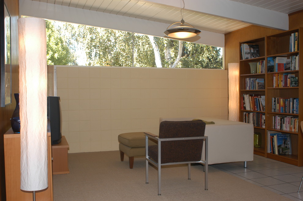 Design ideas for a small midcentury open plan games room in San Francisco with yellow walls, porcelain flooring, no fireplace and a freestanding tv.