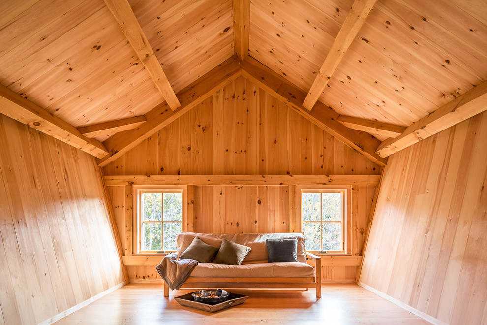 Inspiration for a cottage medium tone wood floor family room remodel in Portland Maine