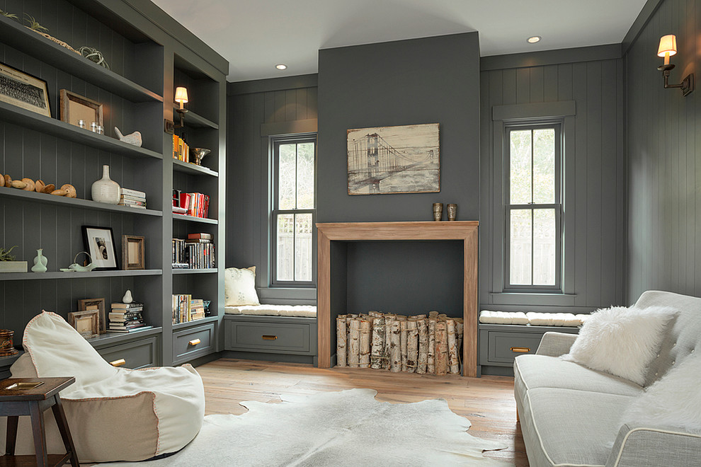 Cottage medium tone wood floor family room library photo in San Francisco with gray walls