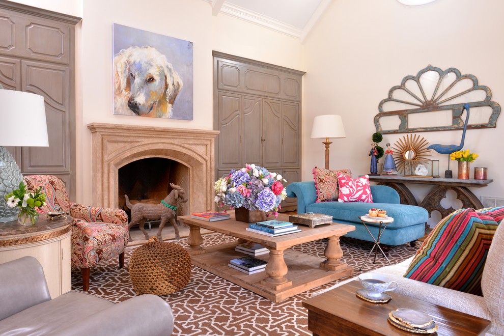 Example of an eclectic formal living room design in Dallas with white walls, a standard fireplace and a concealed tv