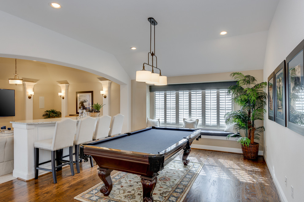 Design ideas for a classic open plan games room in Dallas with a game room, white walls, medium hardwood flooring, no fireplace and a wall mounted tv.
