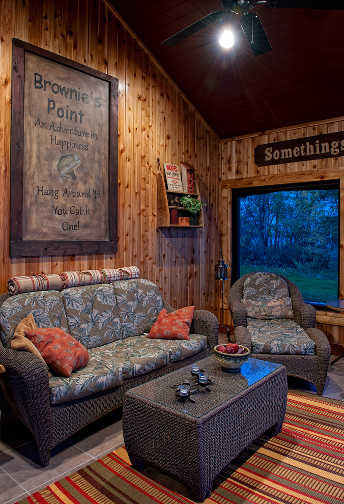 This is an example of a rustic games room in Minneapolis with brown walls.