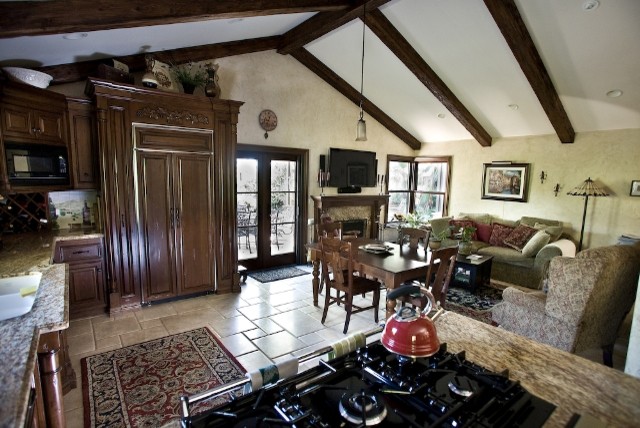 Example of a tuscan family room design in Orange County