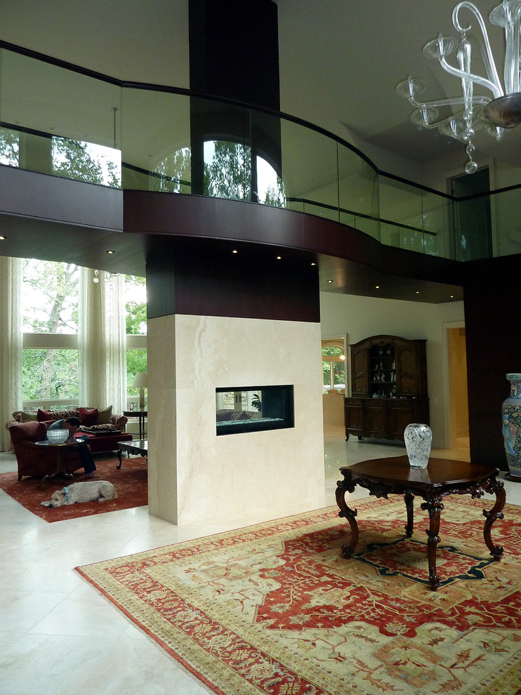 На фото: большая открытая гостиная комната в стиле модернизм с белыми стенами, двусторонним камином, фасадом камина из плитки и белым полом с