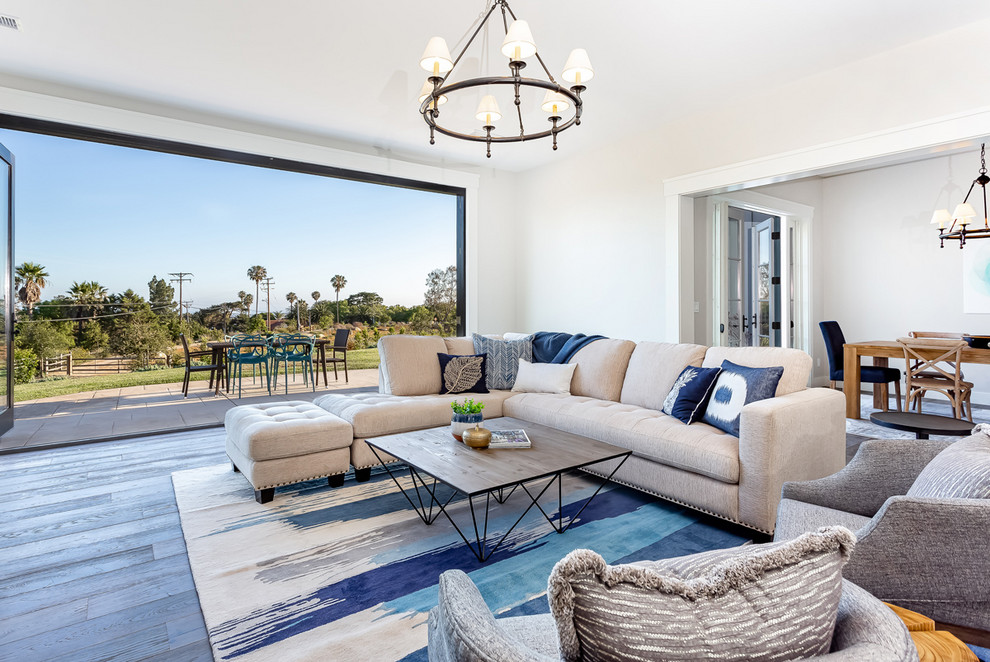 Example of a large transitional open concept family room design in Santa Barbara