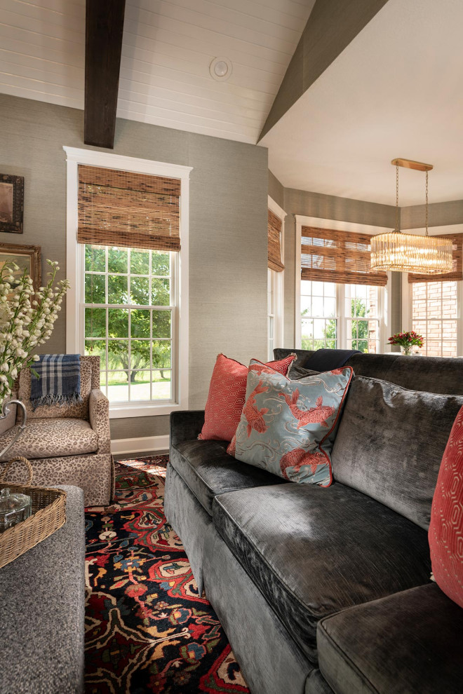 Inspiration for a mid-sized timeless open concept dark wood floor, exposed beam and wallpaper family room remodel in Other with gray walls, a standard fireplace, a wood fireplace surround and a wall-mounted tv