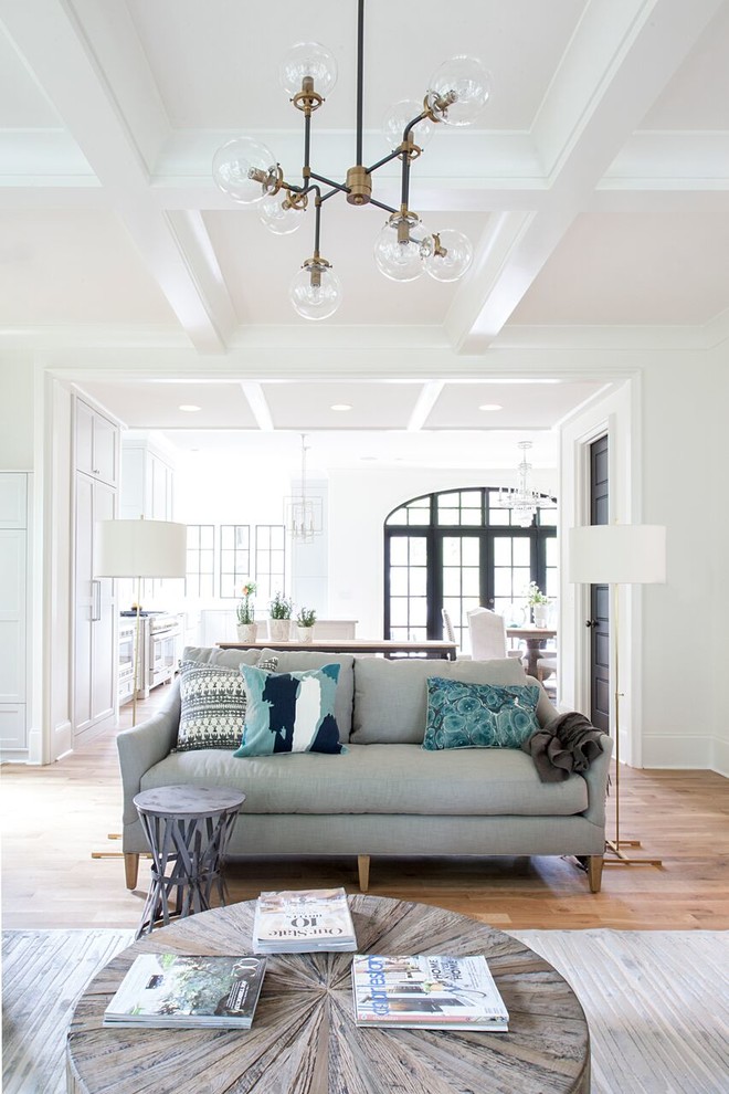 Inspiration for a traditional open plan games room in Charlotte with white walls and medium hardwood flooring.