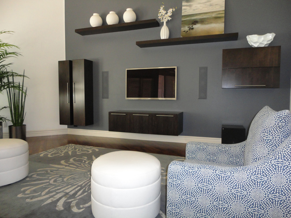 Inspiration for a large contemporary open concept family room remodel in Phoenix with gray walls and a wall-mounted tv