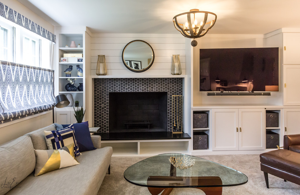 Photo of a medium sized farmhouse open plan games room in DC Metro with white walls, carpet, a standard fireplace, a tiled fireplace surround, a built-in media unit and grey floors.