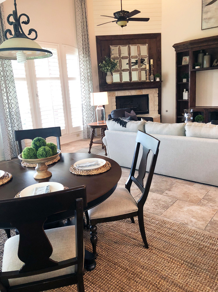 Inspiration for a large rural open plan games room in Dallas with beige walls, travertine flooring, a corner fireplace, a built-in media unit and beige floors.