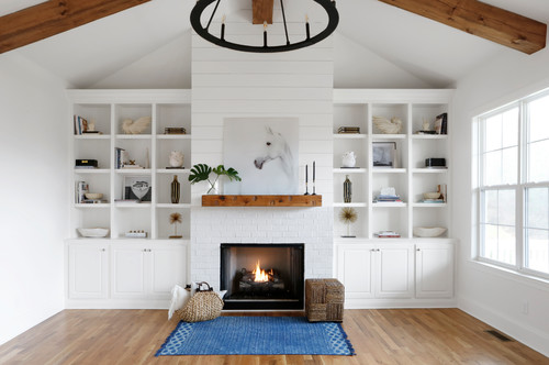 living room with brick fireplace