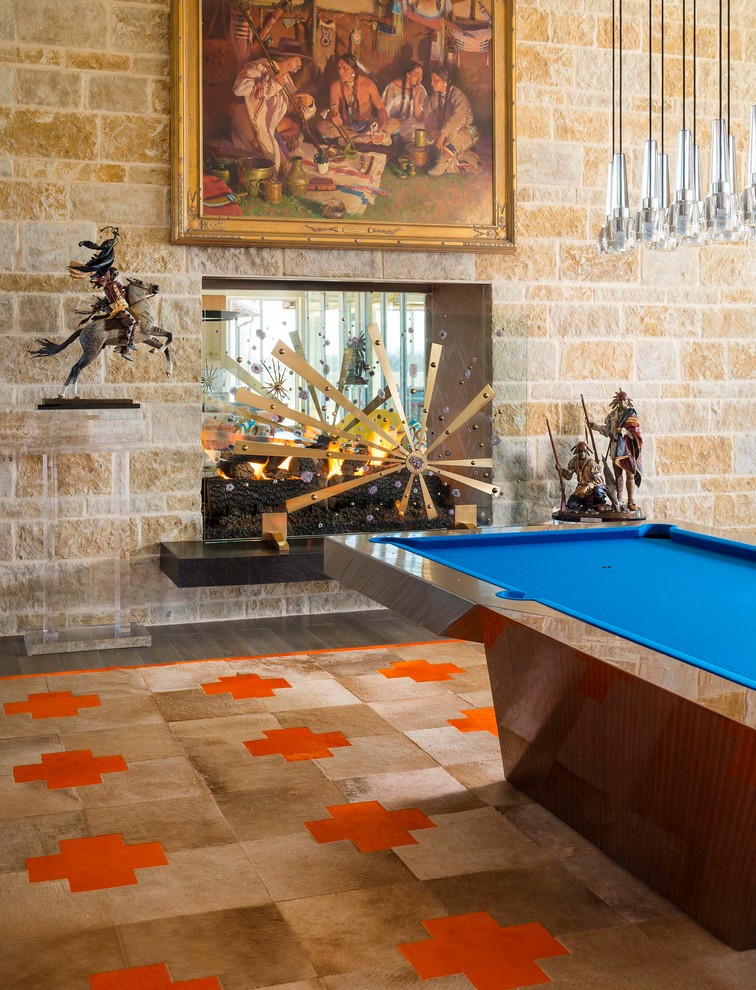 Design ideas for an expansive retro open plan games room in Dallas with a game room, beige walls, porcelain flooring, a two-sided fireplace, a stone fireplace surround, a wall mounted tv and brown floors.