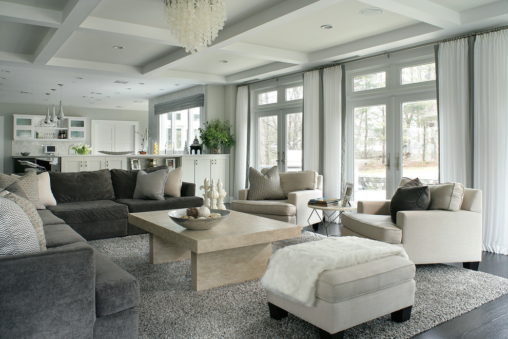 Ejemplo de sala de estar abierta contemporánea con paredes grises y suelo de madera oscura