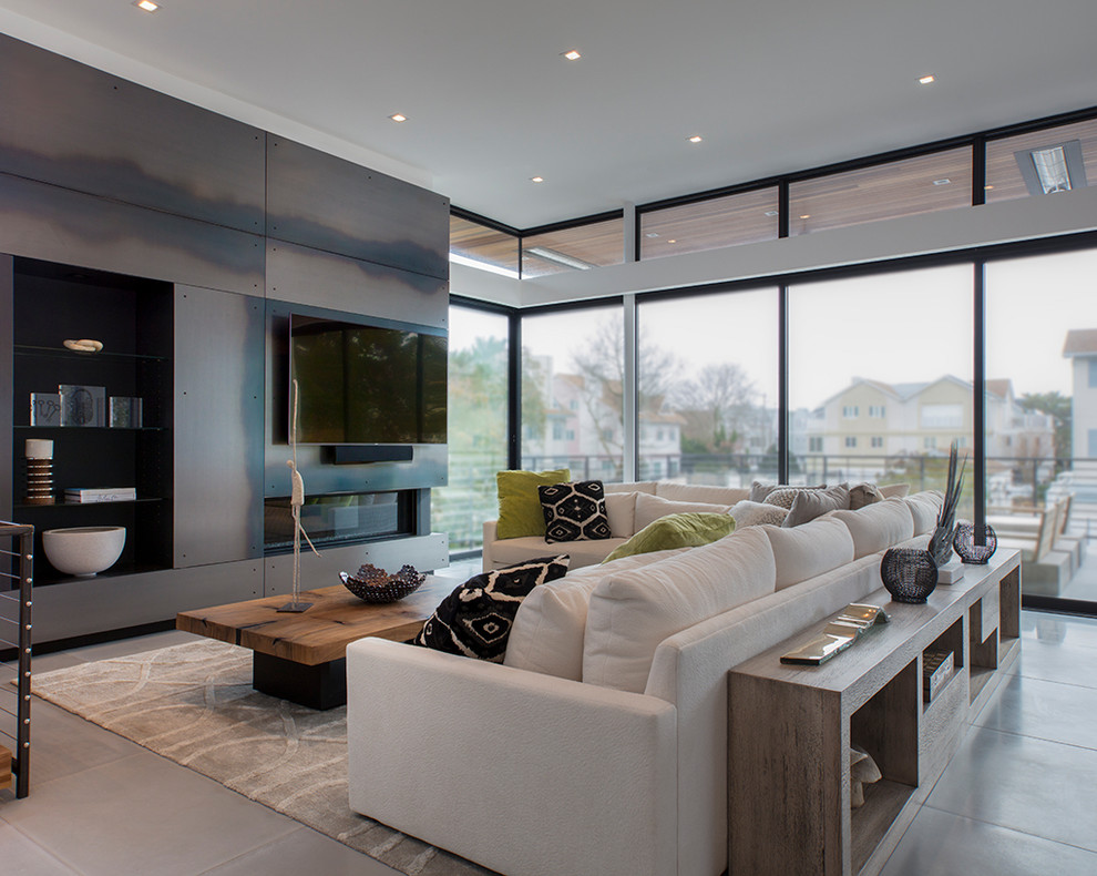 Example of a mid-sized trendy open concept concrete floor and gray floor family room design in Baltimore with white walls, a ribbon fireplace, a metal fireplace and a wall-mounted tv
