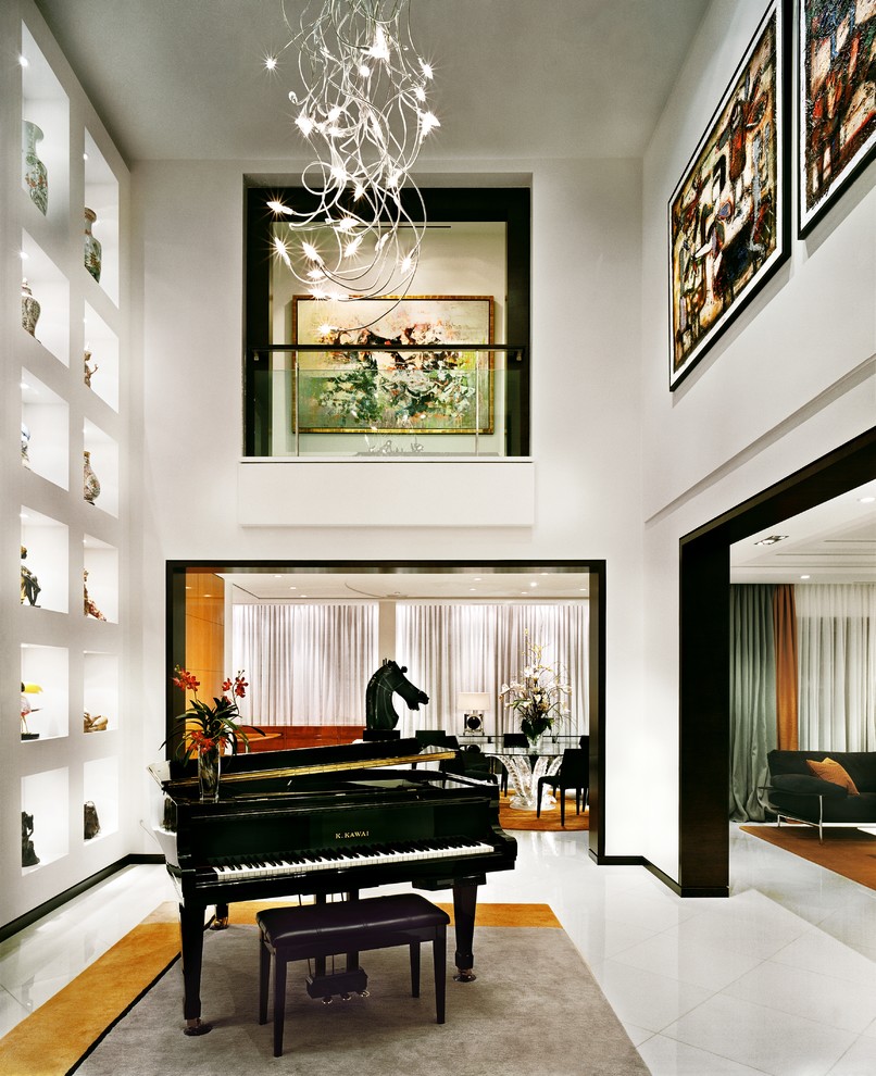 This is an example of a medium sized contemporary open plan games room in Montreal with a music area, white walls, porcelain flooring, no fireplace, no tv and white floors.