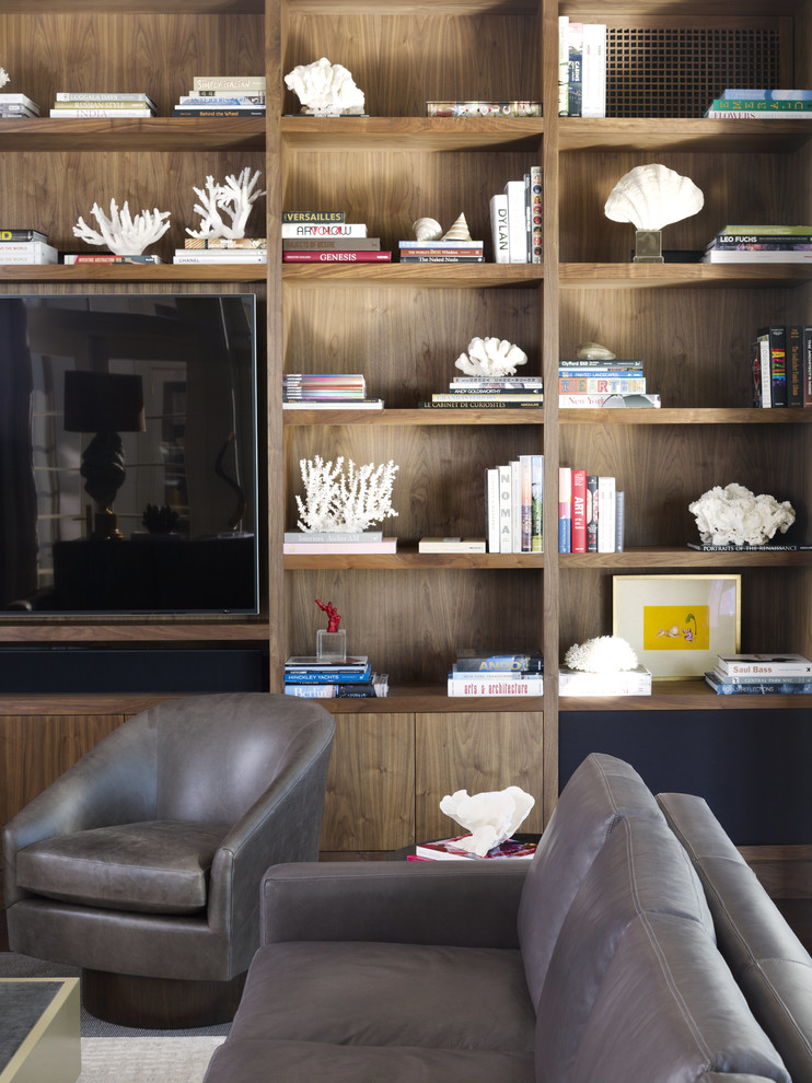 Foto di un grande soggiorno moderno aperto con pareti beige e parete attrezzata