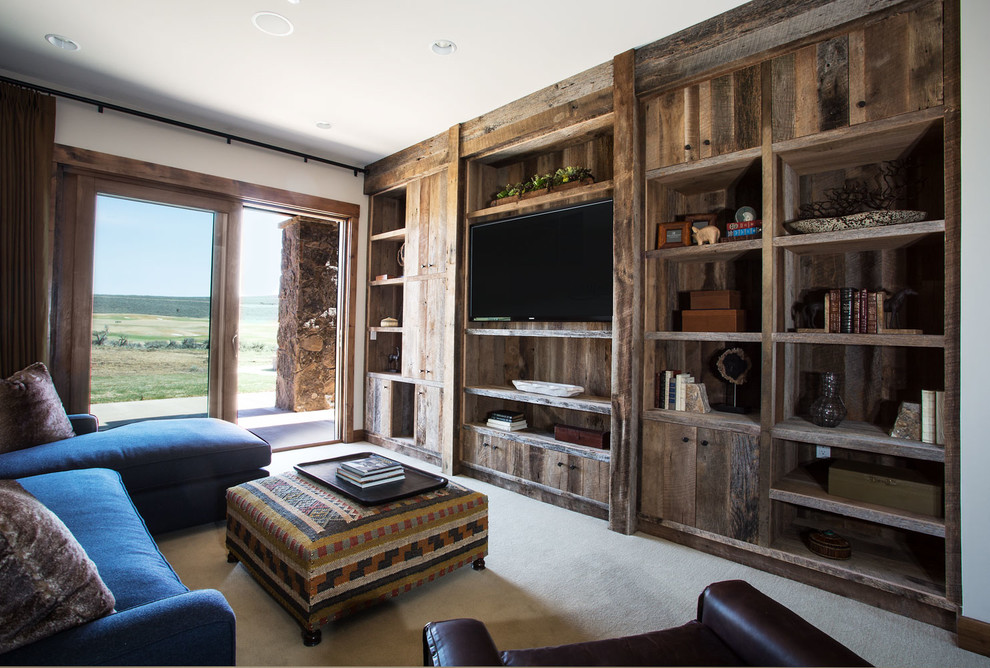 Inspiration for a rustic carpeted family room remodel in Salt Lake City with no fireplace and a wall-mounted tv