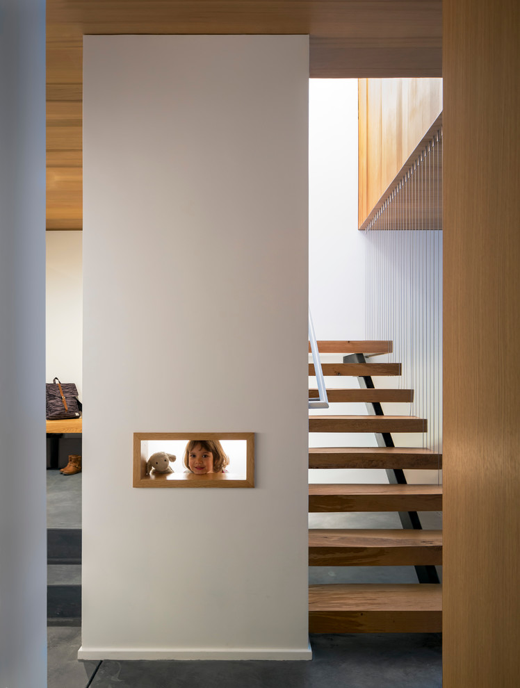 This is an example of a medium sized modern staircase in San Francisco.