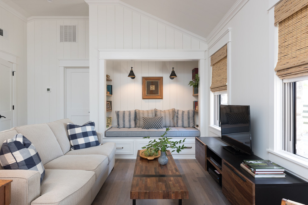 Inspiration for a mid-sized cottage open concept medium tone wood floor and brown floor family room remodel in Other with white walls, no fireplace and a tv stand