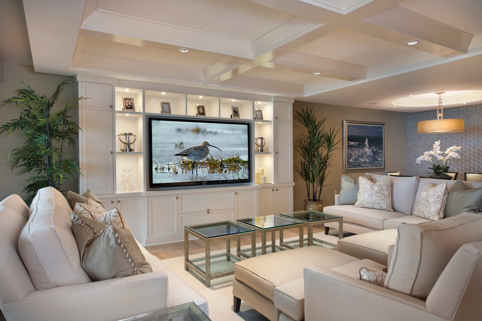 Trendy open concept family room photo in Miami with beige walls and a media wall