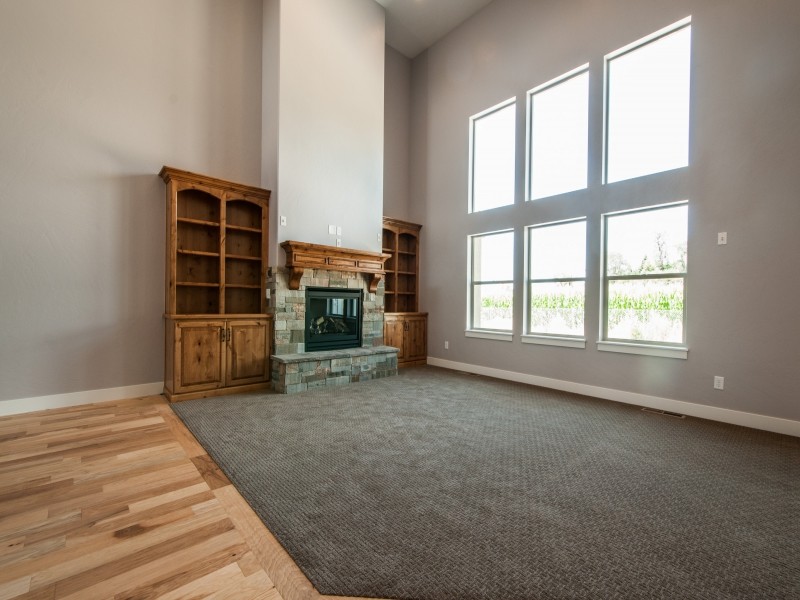 Design ideas for a large classic open plan games room in Salt Lake City with grey walls, carpet, a standard fireplace and a stone fireplace surround.