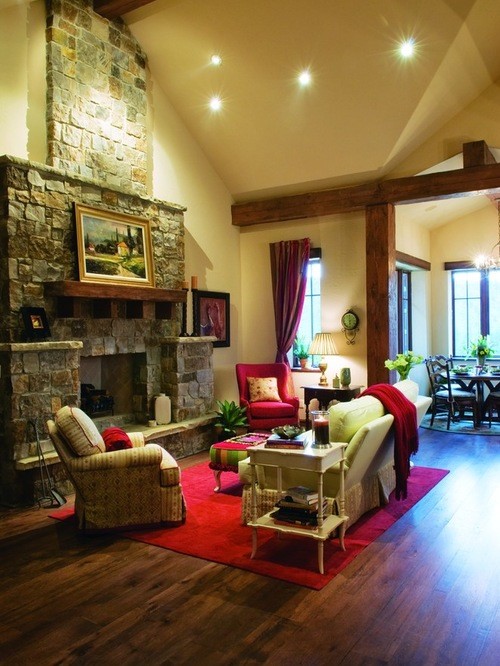 Example of a mountain style family room design in Denver with a standard fireplace and a stone fireplace