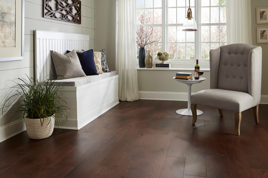 Inspiration for a small country enclosed dark wood floor and brown floor family room remodel in New York with gray walls, no fireplace and no tv