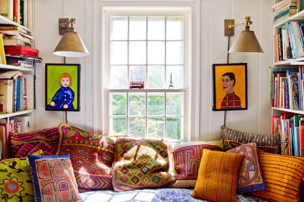 Example of a farmhouse family room library design in New York