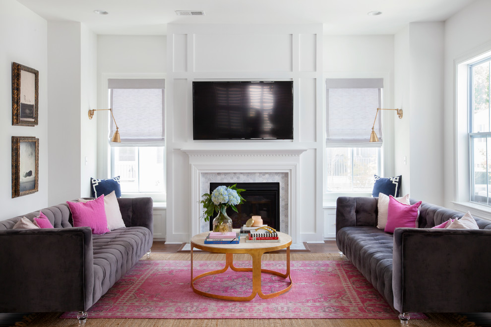 Example of a classic family room design in Charleston with white walls, a standard fireplace and a wall-mounted tv