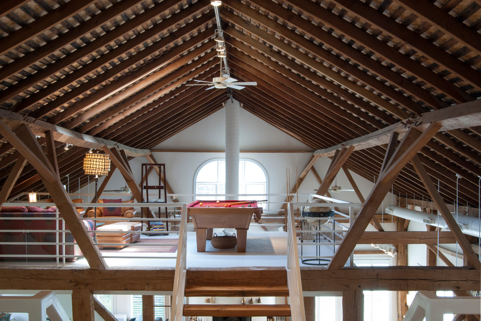 Example of a large farmhouse loft-style carpeted family room design in Other with no tv