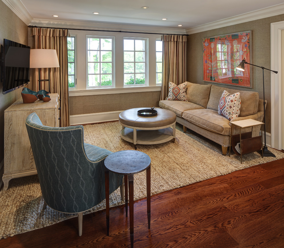 Mid-sized elegant enclosed medium tone wood floor family room photo in Cleveland with brown walls, no fireplace and a wall-mounted tv